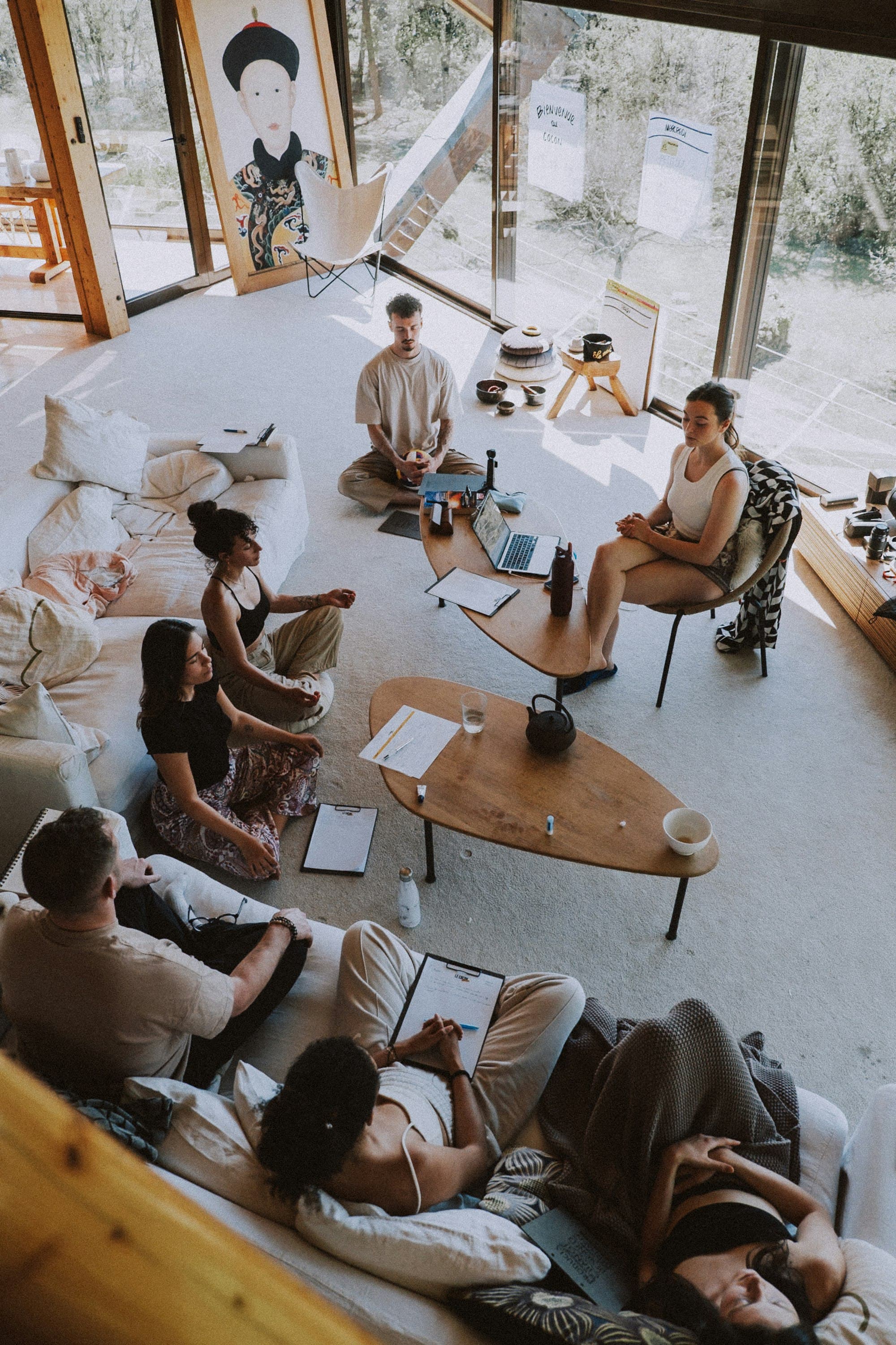 A small group seated in a circle in the great room